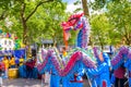 People perform dragon dance for promoting the Falun Gong Chinese religious spiritual