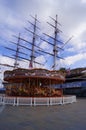 London, UK: Merry-go-round and the Cutty Sark in Greenwich