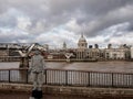 London, UK - 01/25/2019, Millennium bridge in London. Thames river. Black and white man