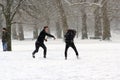 London, uk, 2nd march 2018 - Green Park covered in snow as comuters walk to work beast from the east meets storm sally Royalty Free Stock Photo