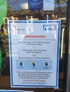 NHS Coronavirus covid-19 sign in chemist window outlining advice to possibly infected people to contact 111