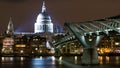 London UK. Night view of St.Paul`s Cathedral and the Millennium Bridge from the South Bank. Royalty Free Stock Photo