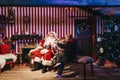 Children meeting Santa Claus at Winter Wonderland Christmas Fair, London, UK