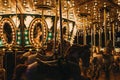 Close up of illuminated merry-go-round at Winter Wonderland Christmas Fair in London, UK.