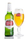 LONDON, UK -NOVEMBER 29. 2016 Cold Bottle and glass of Stella Artois beer on white background, prominent brand of Anheuser-Busch Royalty Free Stock Photo