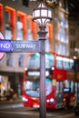 Underground sign and double decker. Festive decorations and Christmas lights at Piccadilly Circus. Royalty Free Stock Photo