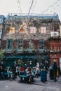 People under the Christmas lights in Neal`s Yard, Covent Garden Royalty Free Stock Photo