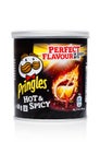 LONDON, UK - November 17, 2017: Pringles potato chips hot and spicy in mini tube on white. Potato and wheat-based stackable snack Royalty Free Stock Photo