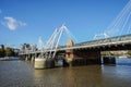 Queen`s Golden Jubilee Footbridges across the Thames River in blue sky in London Royalty Free Stock Photo