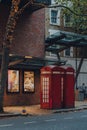 Red phone boxes in front of Sadlers Wells Theatre in London, UK Royalty Free Stock Photo