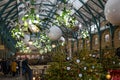 Visitors in Covent Garden`s popular Apple Market decorated for Christmas. The Market is a great Royalty Free Stock Photo