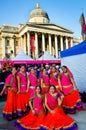 Group of beautiful Indian women in Trafalgar square, London.