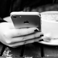 Close up Of A young Woman Holding And Using Her Smartphone