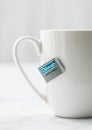 LONDON, UK - OCTOBER 21, 2020: Dilmah Earl Grey tea in white ceramic cup on light background