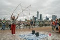 London, UK - October 2019: Giant soap bubbles show - street performers entertain tourists Royalty Free Stock Photo