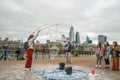 London, UK - October 2019: Giant soap bubbles show - street performers entertain tourists Royalty Free Stock Photo