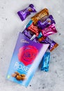 LONDON, UK - OCTOBER 10, 2019: Opened Gift box of cadbury Roses mix chocolate candies on light table background