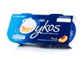 LONDON, UK - OCTOBER 20, 2018: Pack of Oykos luxury greek style creamy yogurt with fruit layer on white background. Peach. Product Royalty Free Stock Photo