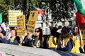 Protestors linked to the Iranian group Mojahedin-e Khalq demonstrate in Whitehall, near the