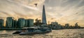 LONDON, UK - October 17th, 2017: The Shard building view from Thames riverside with river cruising ships in view, sunset Royalty Free Stock Photo