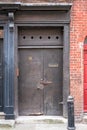 Painted doorway at entrance to traditional Huguenot weaver`s house on Princelet Street, Spitalfields, East London UK