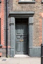 Painted doorway at entrance to traditional Huguenot weaver`s house on Princelet Street, Spitalfields, East London UK