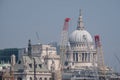 London UK. Panoramic vew of the iconic dome of St Paul`s Cathedral, the River Thames, cranes and buildings under construction Royalty Free Stock Photo