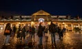 London, UK: People admiring the Christmas trees and lights outside Covent Garden Market