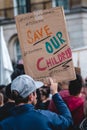 People with banners and placards shouting at Save Our Children Protest against Children Trafficking Royalty Free Stock Photo