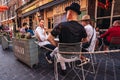 People sitting on the busy restaurant terrace in Soho area during Coronavirus lockdown ease