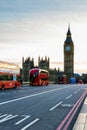London, the UK. Red bus in motion and Big Ben, the Palace of Westminster. The icons of England Royalty Free Stock Photo