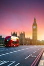 London, the UK. Red bus in motion and Big Ben, the Palace of Westminster. The icons of England Royalty Free Stock Photo