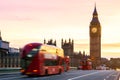 London, the UK. Red bus in motion and Big Ben, the Palace of Westminster. The icons of England Royalty Free Stock Photo