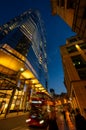 London, UK: Red London bus with motion blur on Bishopsgate in the City of London at dusk Royalty Free Stock Photo