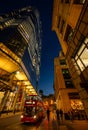 London, UK: Red London bus with motion blur on Bishopsgate in the City of London at dusk Royalty Free Stock Photo