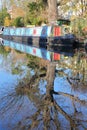 LONDON, UK: Reflections in Little Venice with colorful barges along canals