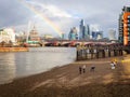 London, UK - Saturday 21st October 2023: Rainbow over St Pauls looking over the river Thames with people on shore line Royalty Free Stock Photo