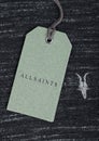 LONDON, UK - SEPTEMBER 09, 2020: ALLSAINTS logo and clothing tag on cotton fabric