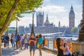 Big Ben and Houses of Parliament. Vie time in the City of London. Office workers having a lunch in park next to st. Paul cathedral Royalty Free Stock Photo