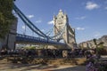 London cityscape across the River Thames with a view of diners in the shadow of Tower Bridge, Royalty Free Stock Photo