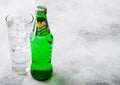 LONDON, UK - SEPTEMBER 28, 2018: Glass and bottle of Sprite soda drink with ice cubes and bubbles on stone kitchen table backgroun