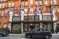 London, UK - September 14, 2023: A luxurious 5-star hotel Claridge's in London's Mayfair with black London cab