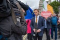 A man in a suit being filmed and interviewed at a Brexit protest outside Parliament in London Royalty Free Stock Photo