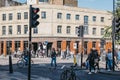 People crossing the road in front of AllSaints shop in Shoreditch, London, UK Royalty Free Stock Photo