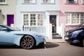 Sportive Blue Car Parked Outside Colorful Houses from London