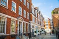 Street view in Mayfair with beautiful periodic buildings. London