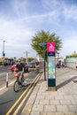 London, UK - September 14, 2023: A super cycle lane, CS8, Cycle Superhighway 8, information board stands tall above the Royalty Free Stock Photo