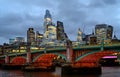 London, UK: Skyscrapers of the City of London at dusk with Southwark Bridge