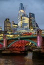 London, UK: Skyscrapers of the City of London at dusk with Southwark Bridge