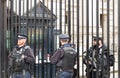 London, UK - 1st April, 2017: Police officers protecting the gate of Downing street in London, the residence of the prime